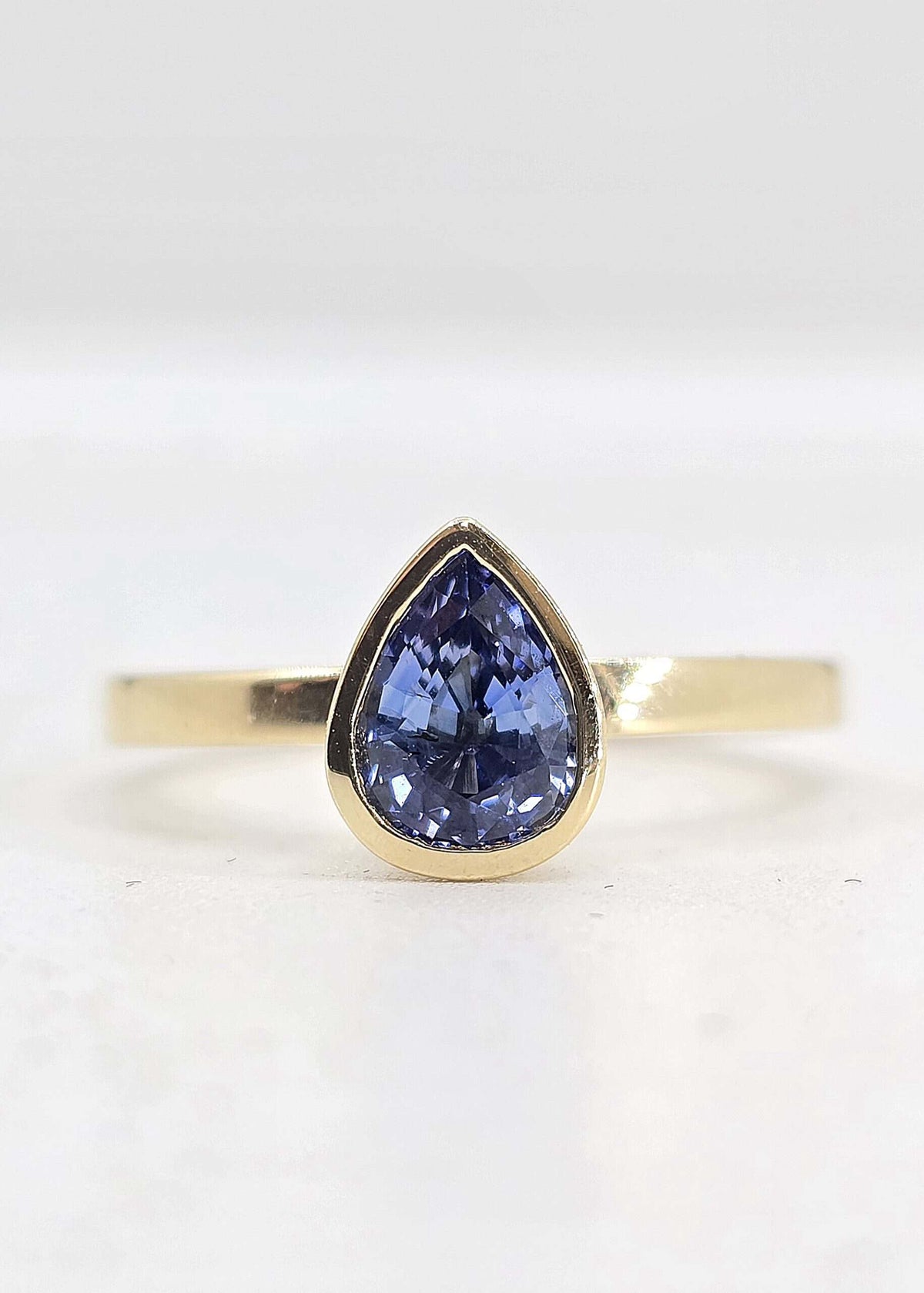 14K gold bezel set sapphire ring