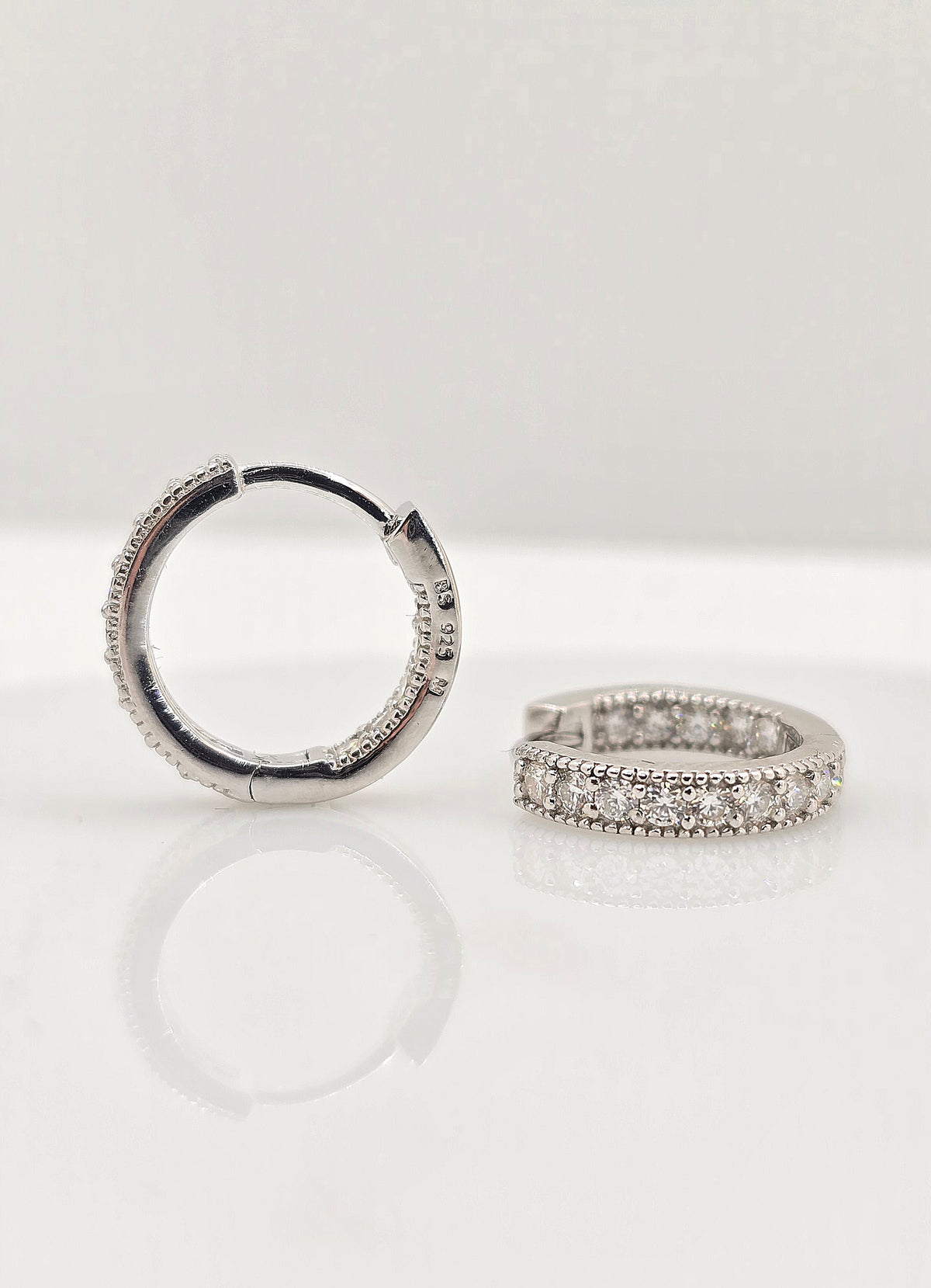 Sterling silver moissanite milgrain huggie earrings, view 3