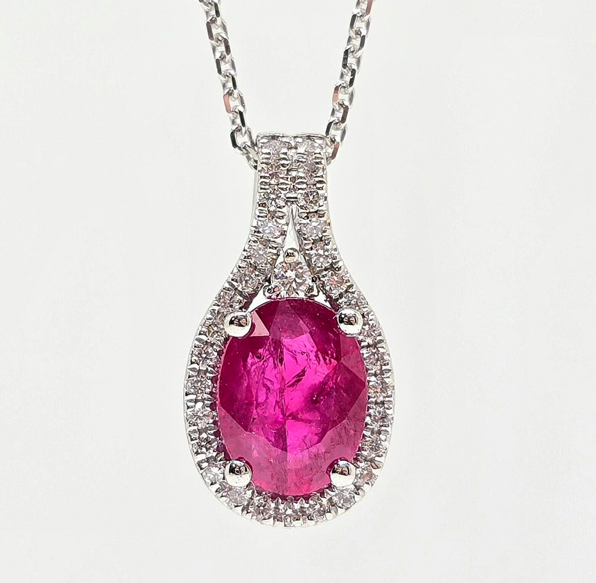 14K gold ruby necklace with diamond halo