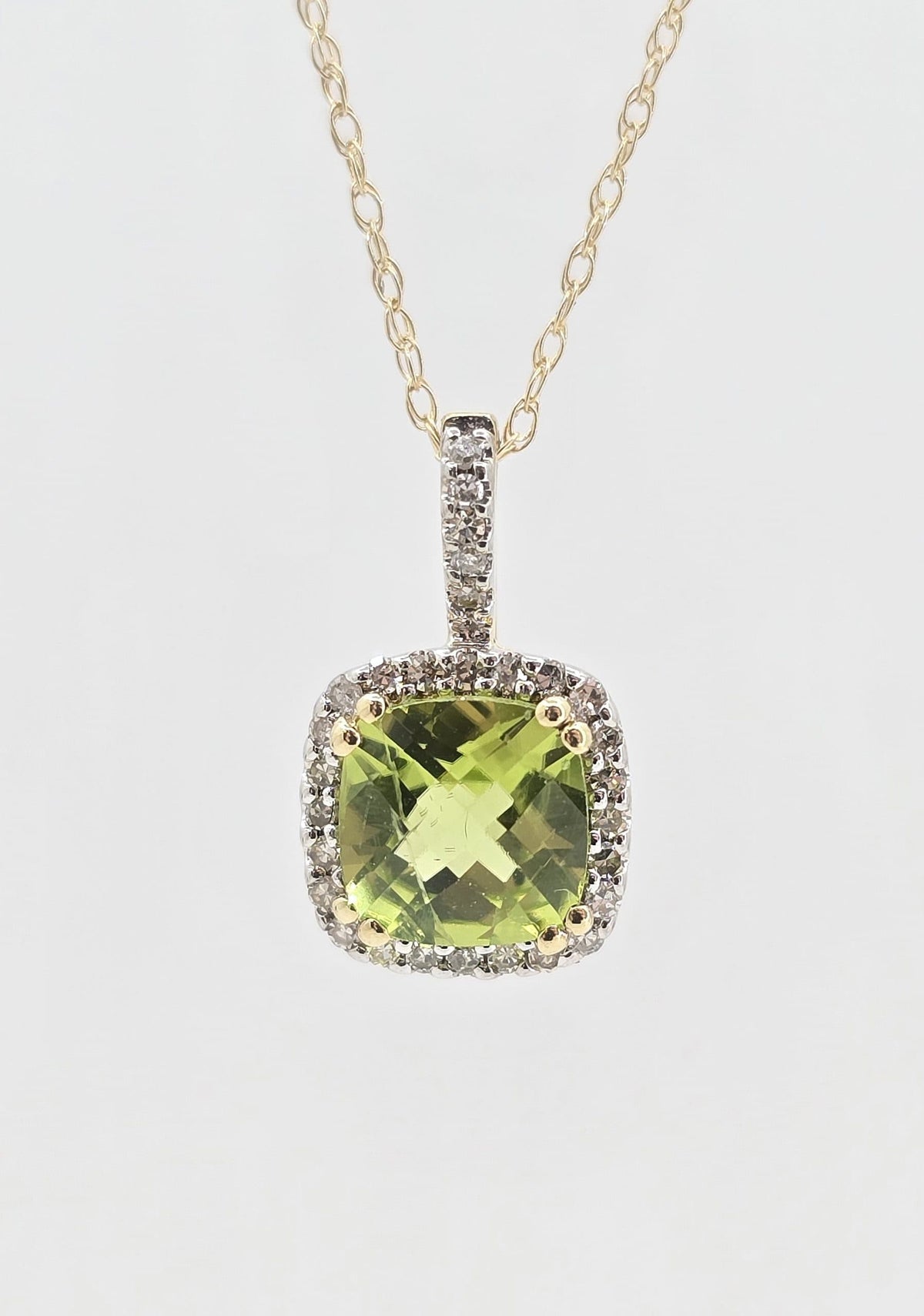 10K gold peridot necklace with diamond halo, 0.85 ct