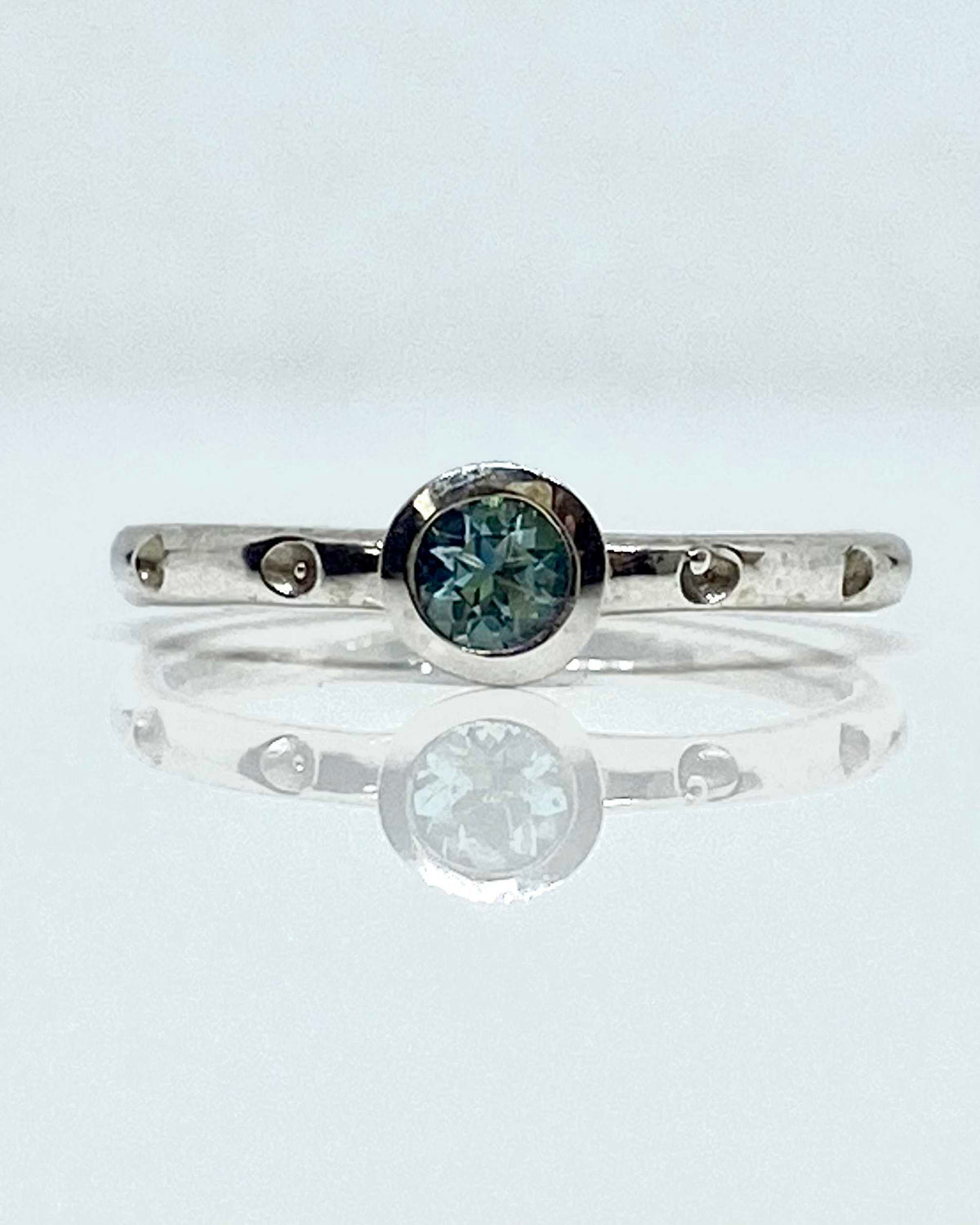 14K white gold bezel set blue topaz ring