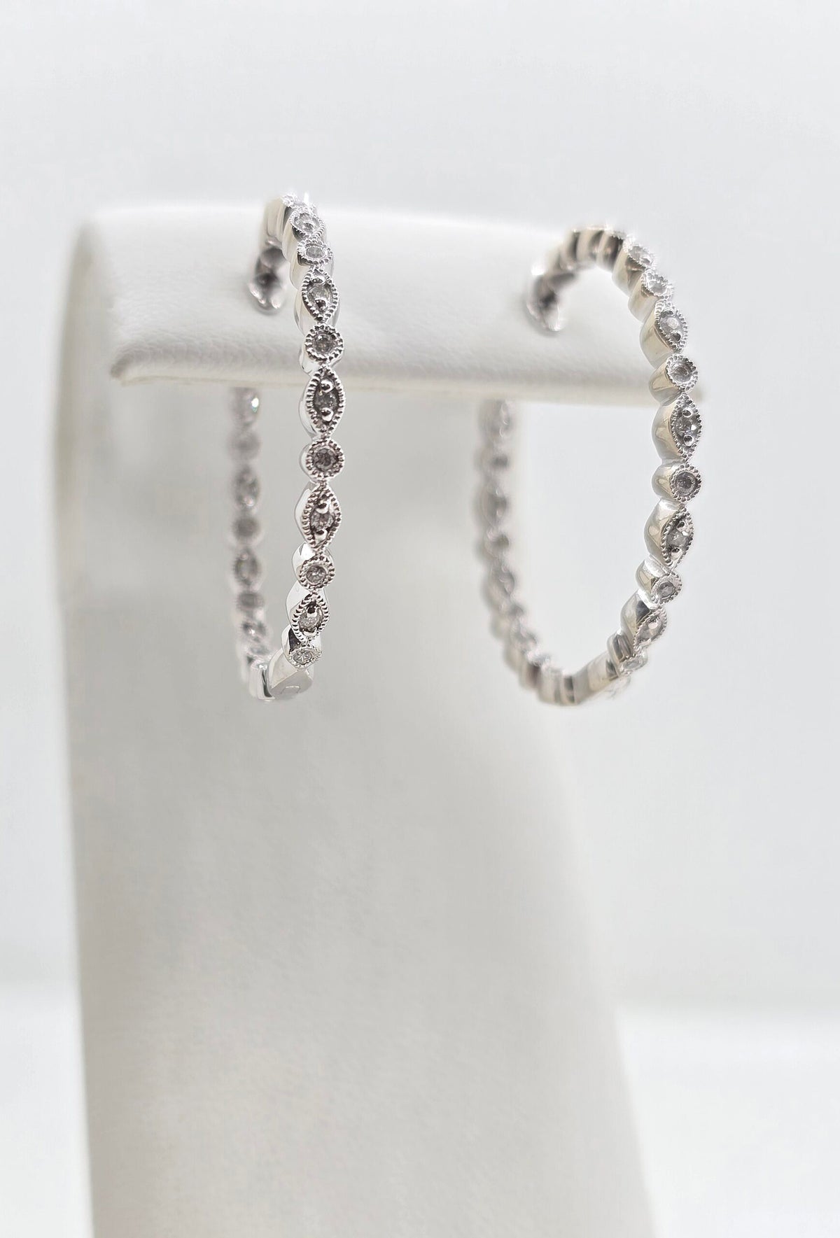 Pre-owned 14K gold in/out diamond hoop earrings