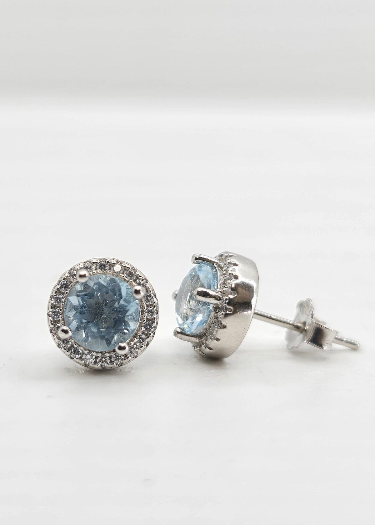 Sterling silver blue topaz halo earrings