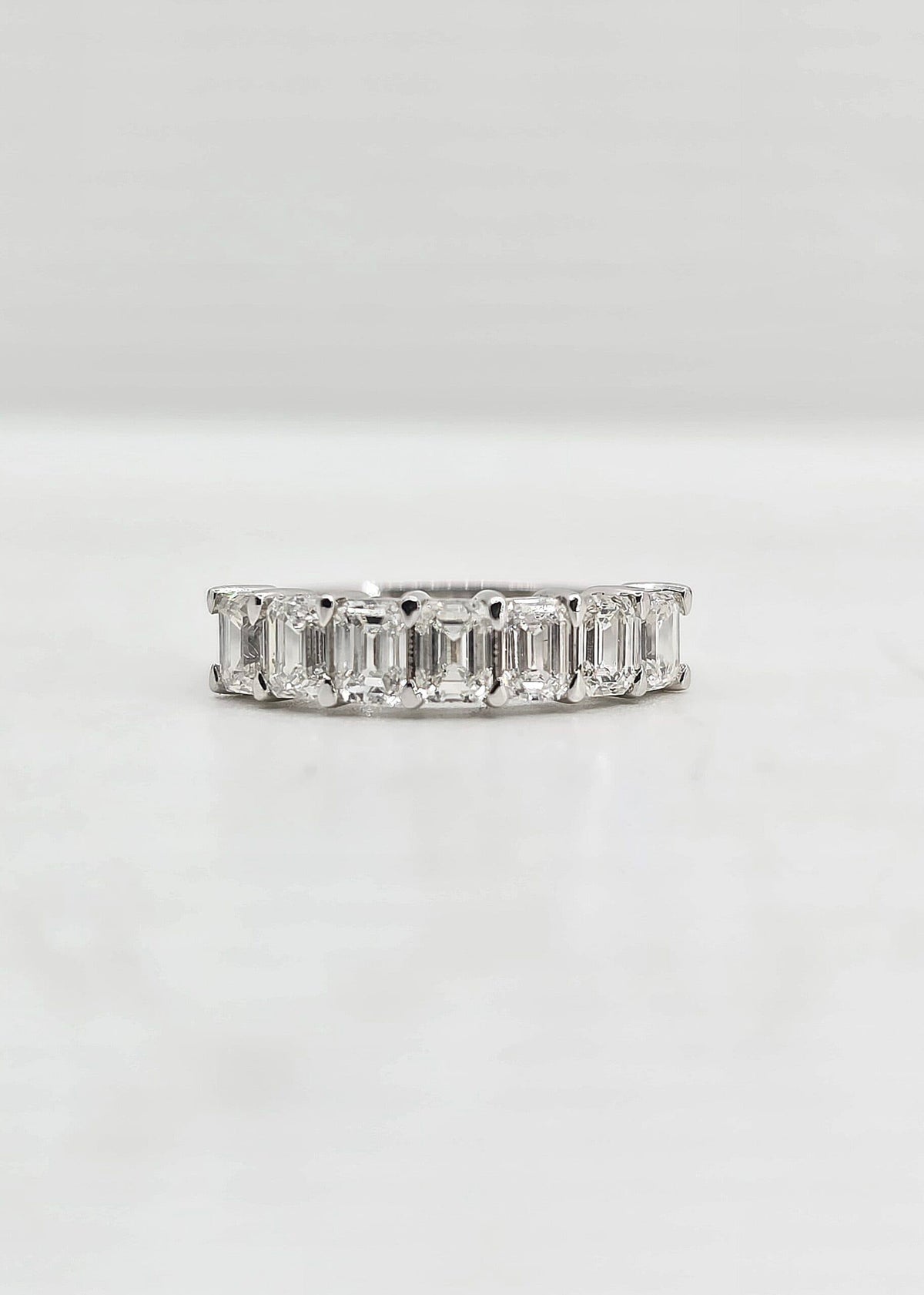 18K gold emerald cut diamond band