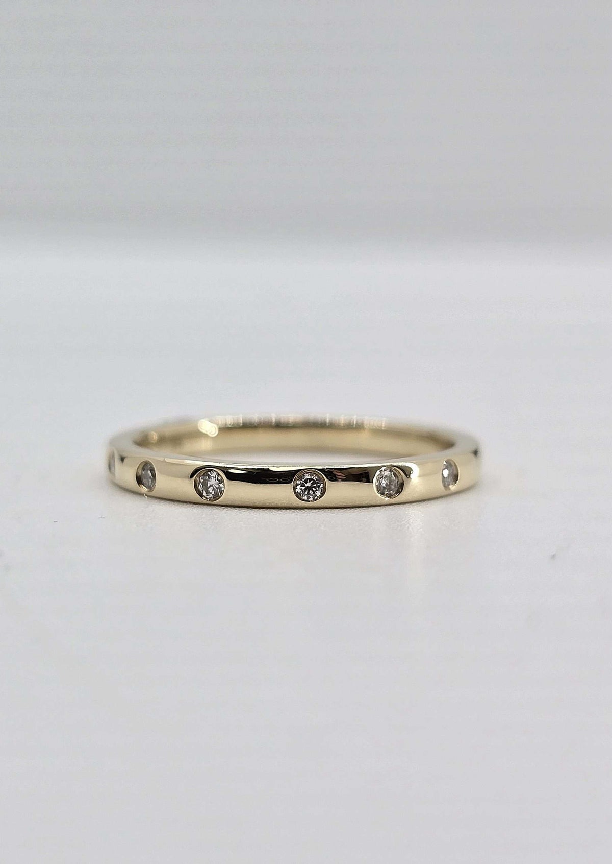 14K gold flush set diamond band