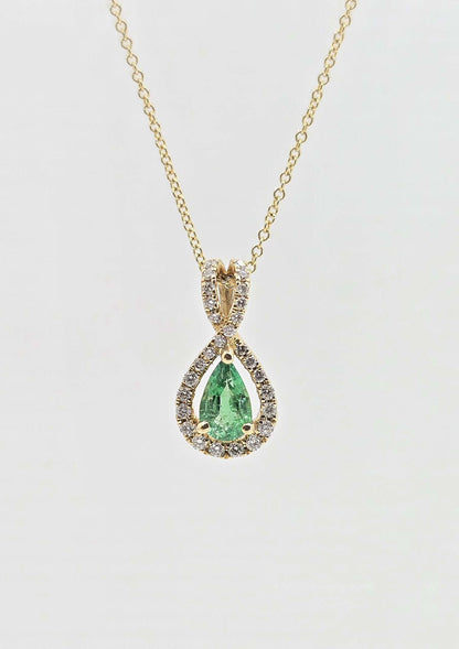 14K gold emerald necklace with diamond halo