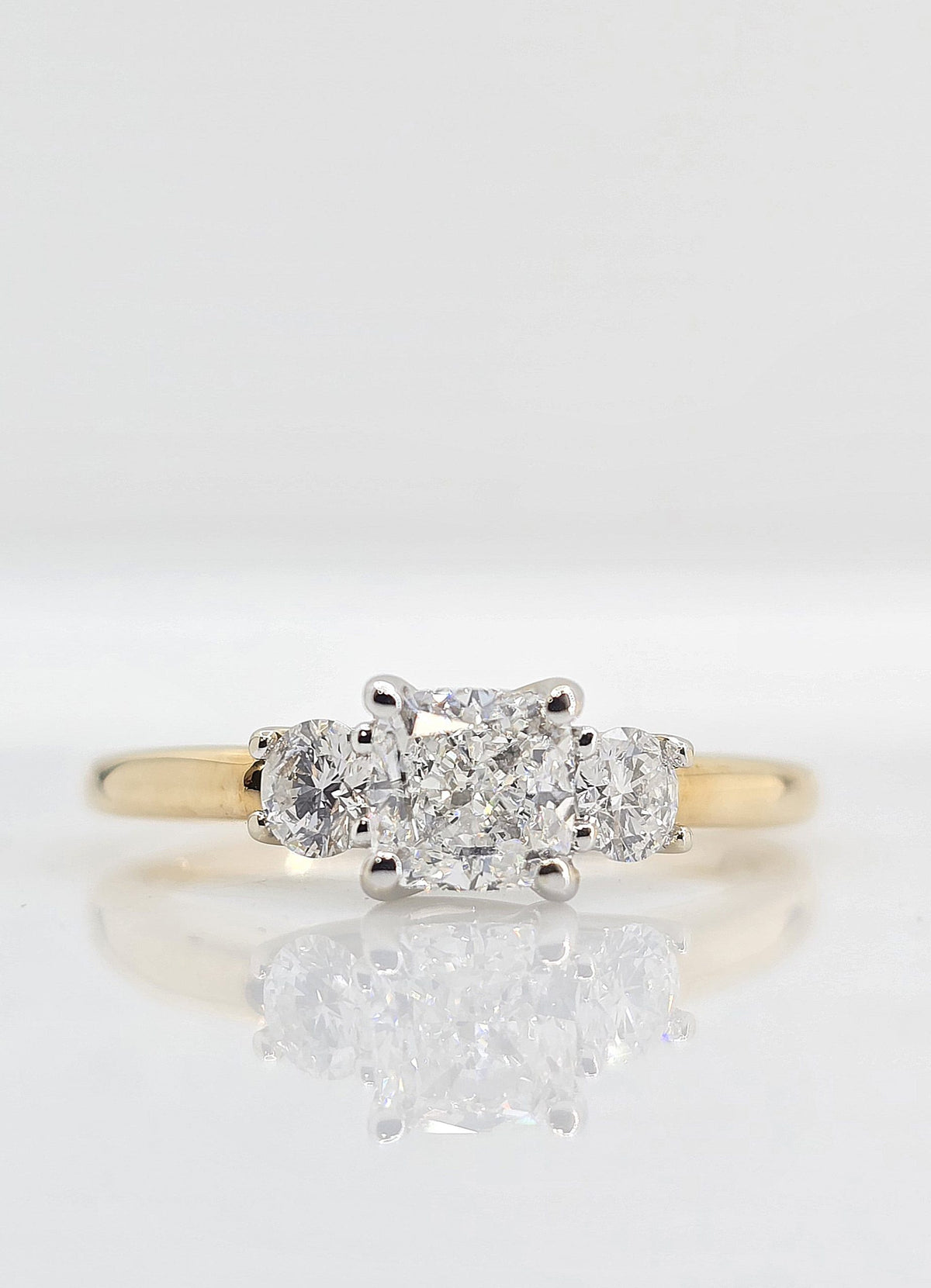 Pre-owned 14K gold cushion diamond three stone engagement ring