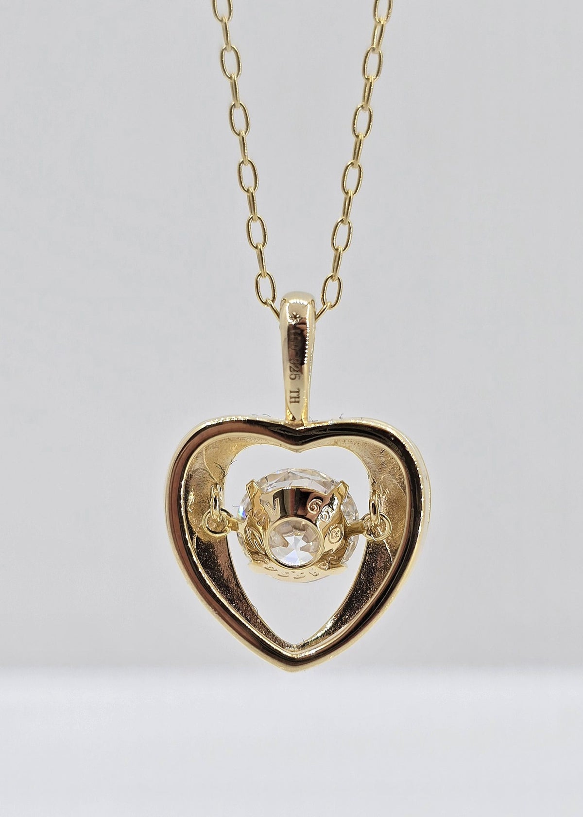 Gold plated sterling silver lab grown diamond heart movement necklace, view 4