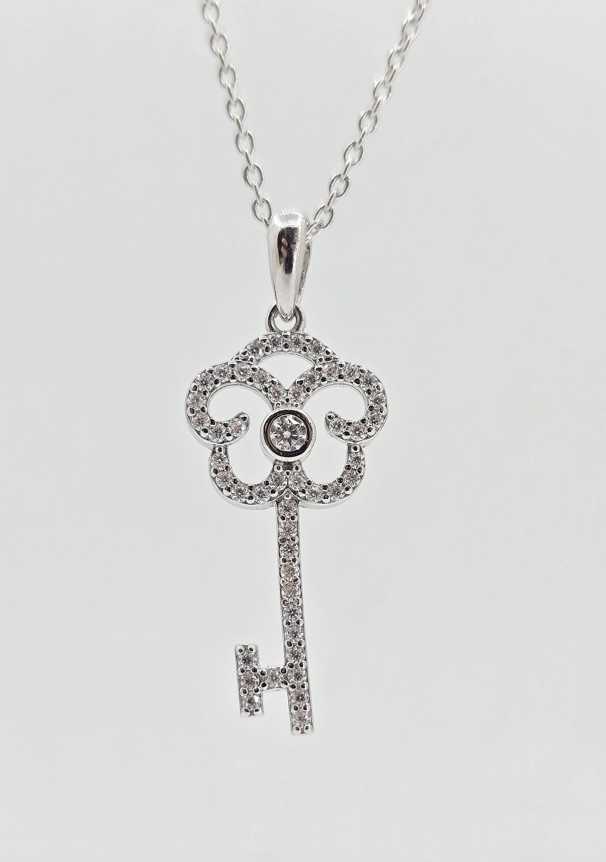 Sterling silver moissanite key necklace