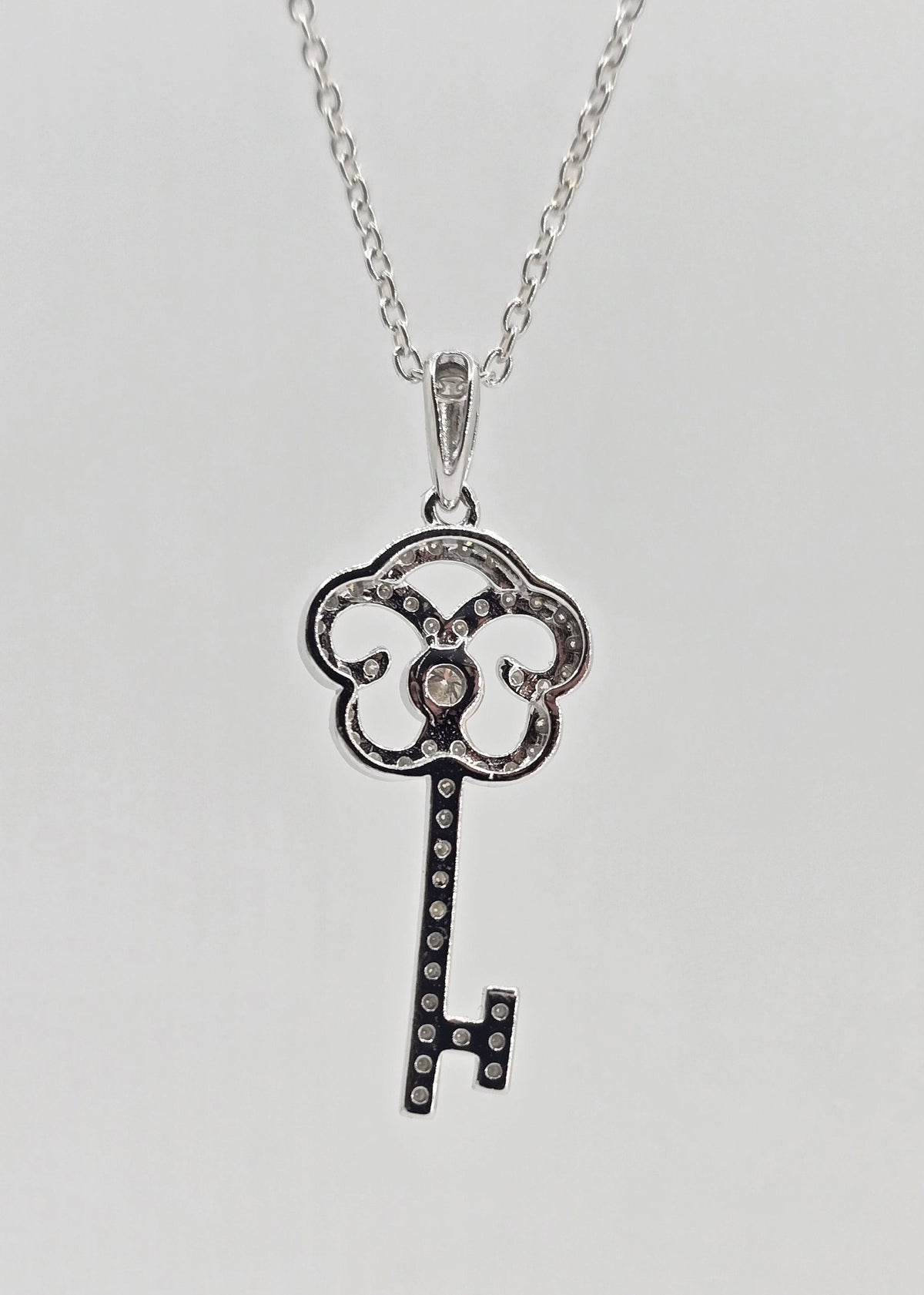 Sterling silver moissanite key necklace, view 3