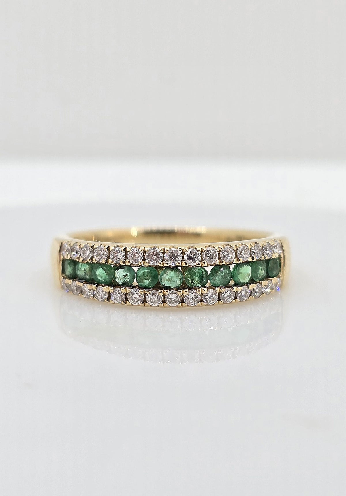14K gold emerald and diamond band