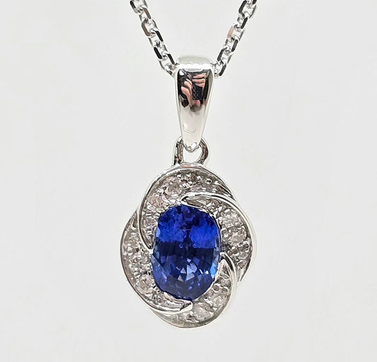 14K gold blue sapphire necklace with floral diamond halo