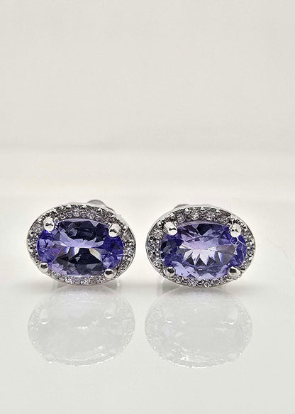 14K gold tanzanite and diamond halo earrings