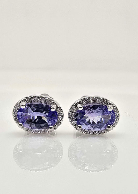 14K gold tanzanite and diamond halo earrings