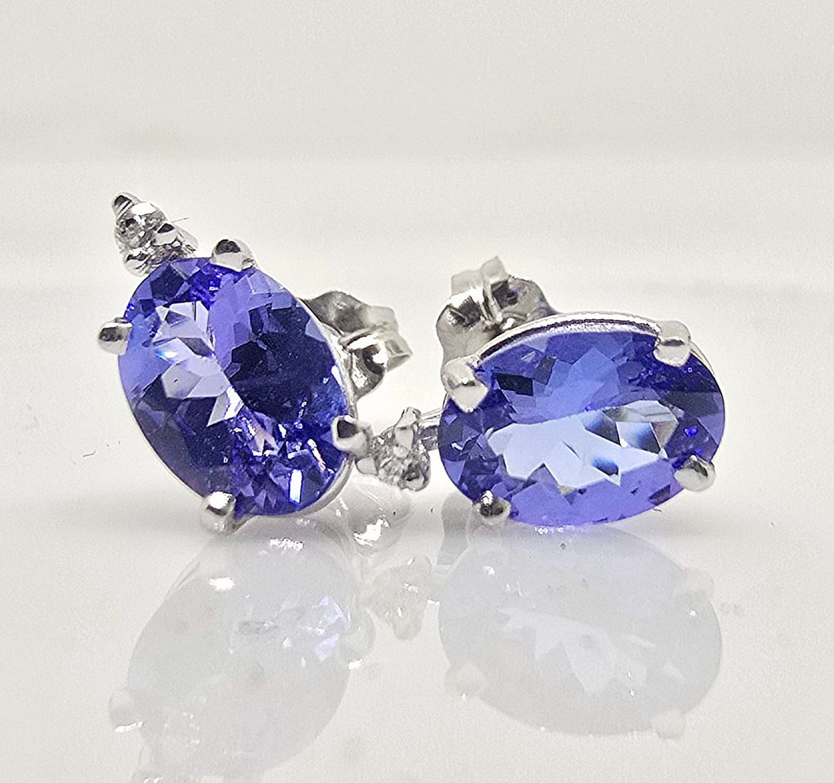 14K gold tanzanite stud earrings with diamond accents