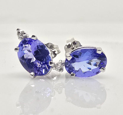 14K gold tanzanite stud earrings with diamond accents