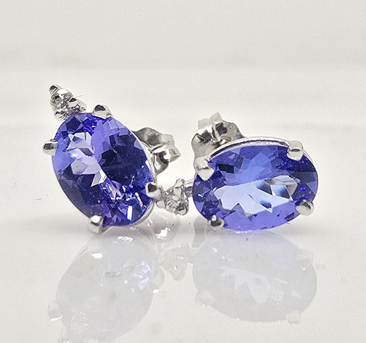 14K gold tanzanite stud earrings with diamond accents