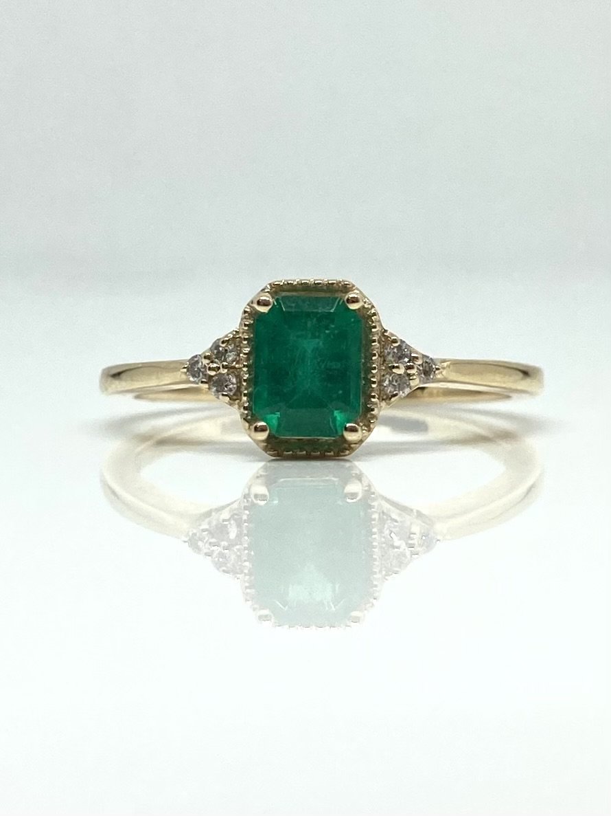 14K yellow gold emerald ring with diamond accents
