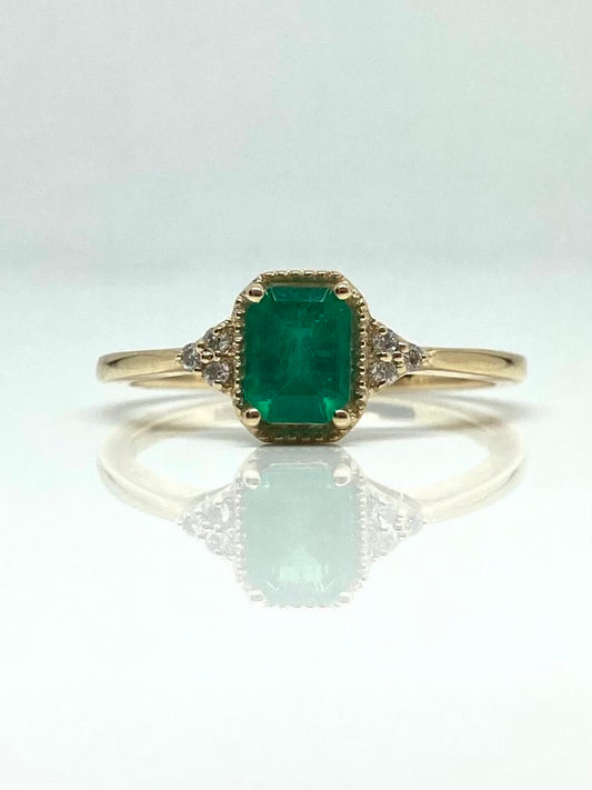 14K yellow gold emerald ring with diamond accents