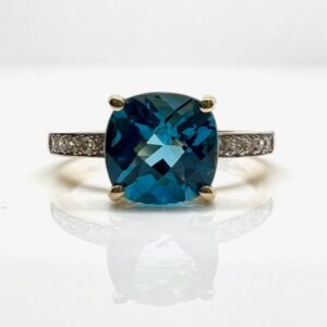 14k Yellow Gold 2.3ct Blue Topaz and .1ctw Diamond Ring