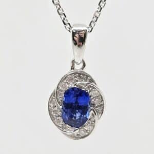 14k .56ct Blue Sapphire with Floral Diamond Halo Necklace