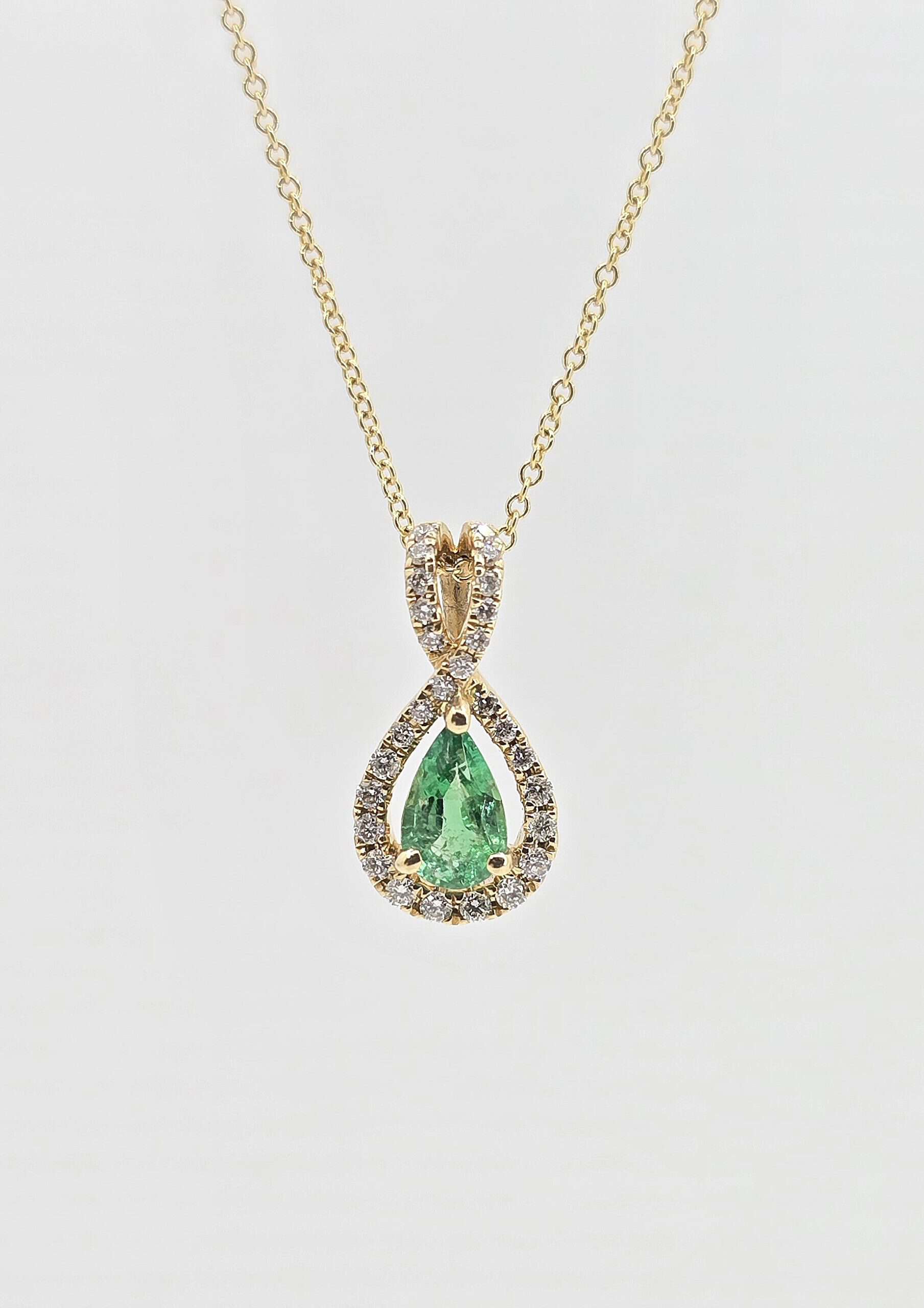 14k .31ct Emerald and Diamond Halo Necklace