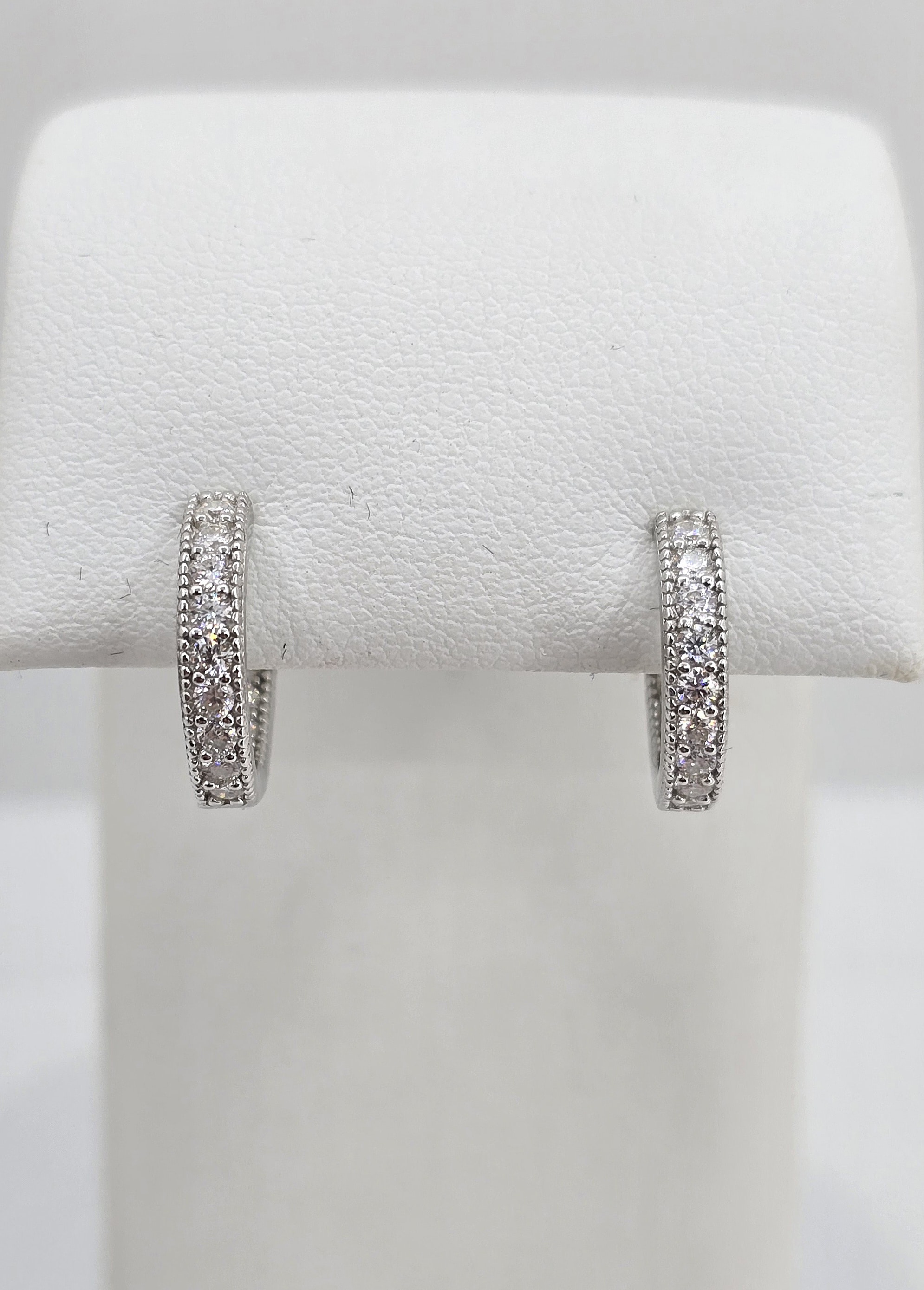 Sterling Silver .62ctw Moissanite Millgrain Huggies
